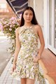 Model wearing Behati Abstract Floral Halter Dress in Green