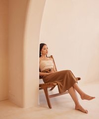 bindi linen ruched cropped top with mallory belted midi skirt seated