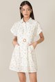 model wearing hvv atelier lucia floral embroidered shirtdress in white