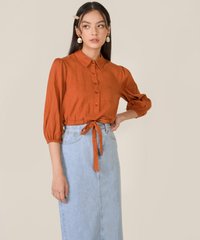 model in elm striped texted blouse in burnt orange and denim midi skirt