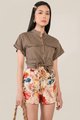 Model in Amie Floral Shorts and Caville Cuff Sleeve Blouse in Taupe Brown