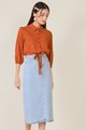 close up view of elm striped texted blouse in burnt orange and denim midi skirt