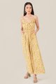 model wearing resa abstract floral ruffle jumpsuit in daffodil colour