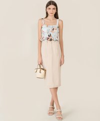 model in Nina Floral Ruched Women's Top in Blue carrying purse