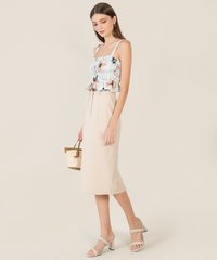 Model in Nina Floral Ruched Women's Top in Blue and Matthieu Quilted Purse