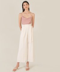 model in theia cowl neck women's camisole top in dust pink and wide leg trousers