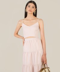 model standing in tulsa gingham women's cropped top and maxi skirt in pink