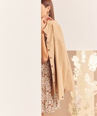 Model in dress and Domino Oversized Outerwear in Tan
