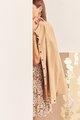 Model in dress and Domino Oversized Outerwear in Tan